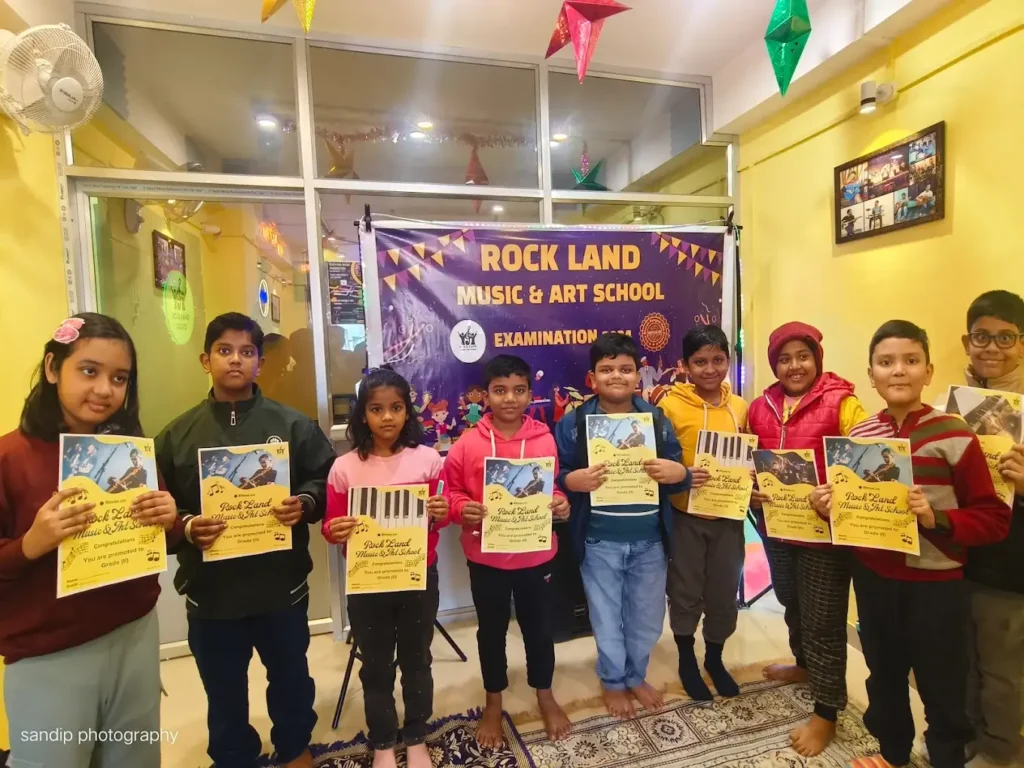 students being certified for completing their music lessons