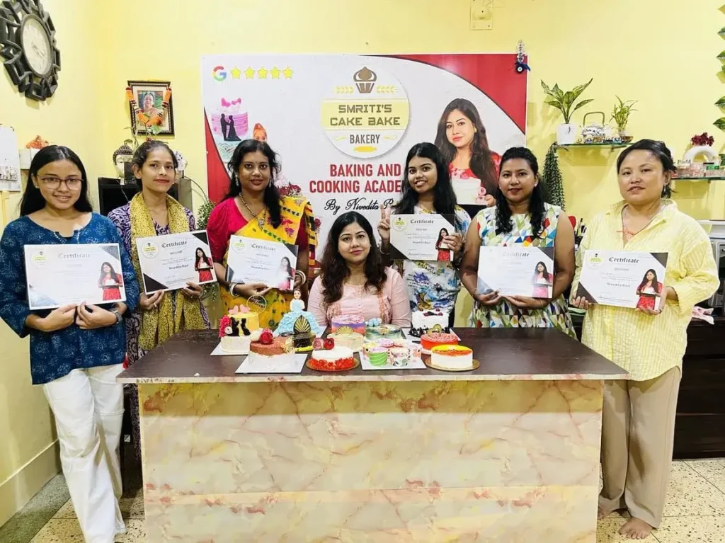 a group of women holding certificates after completing a baking and cooking class