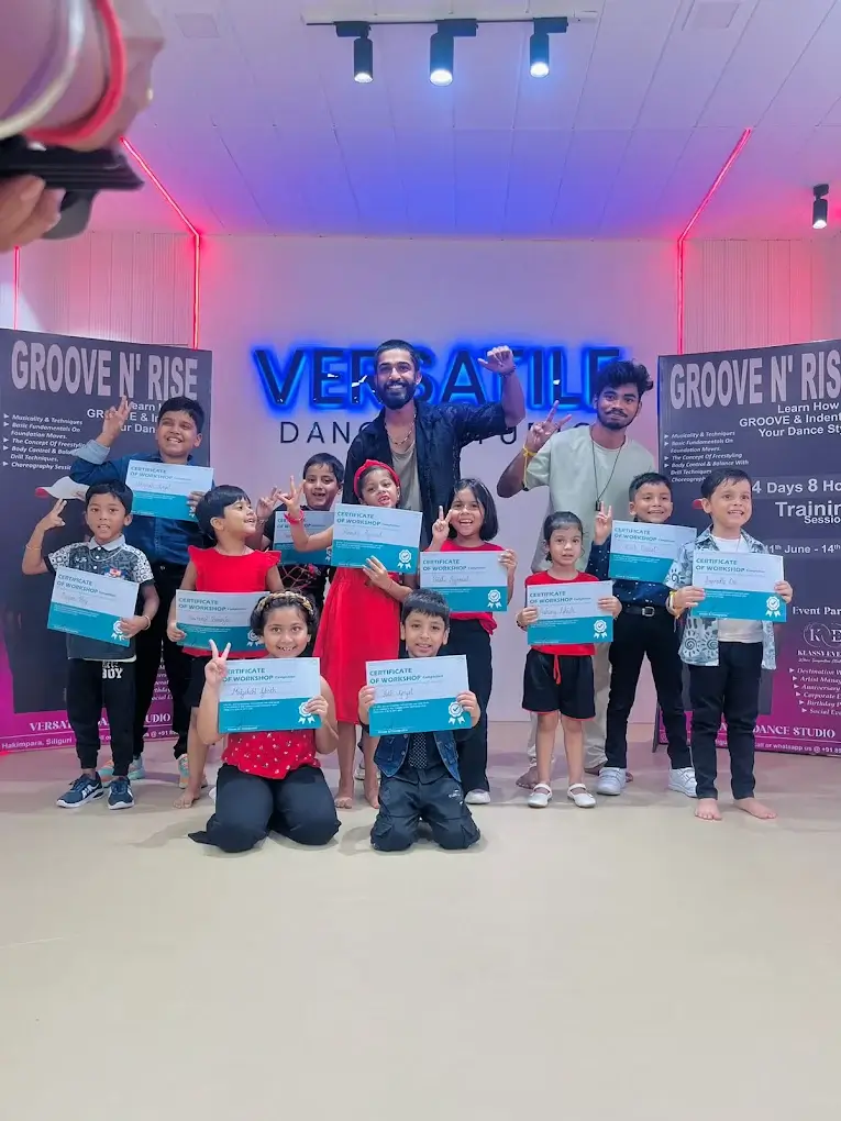 students being certified for completing dance lessons by their teacher