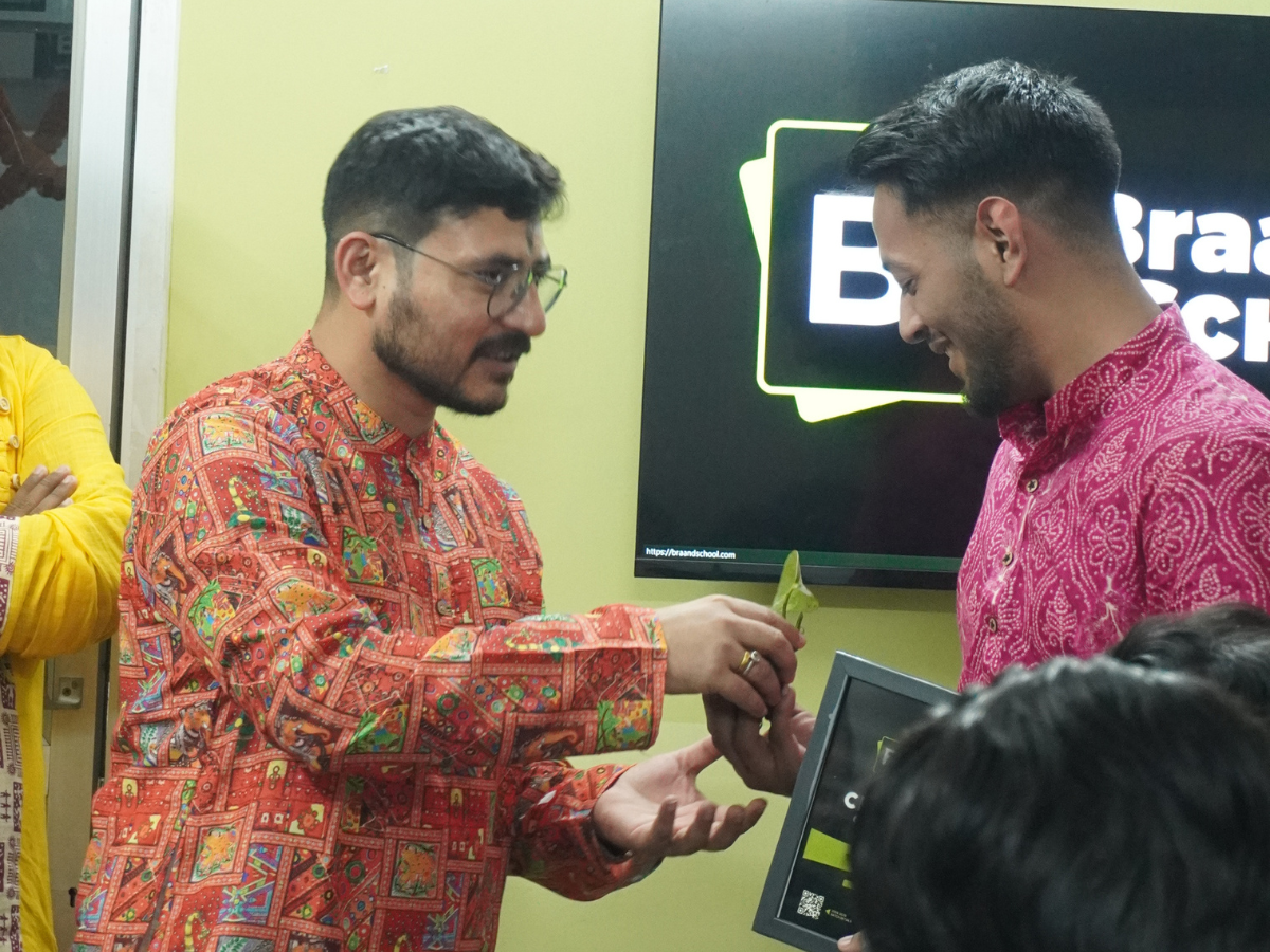 Ankush Sharma being awarded a certificate during a ceremony at Braand School.