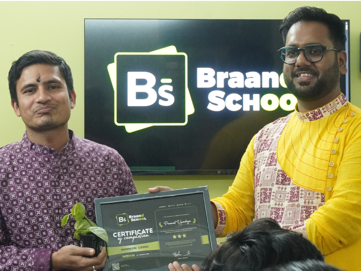 Praneet Upadhya receiving a certificate and plant at Braand School.